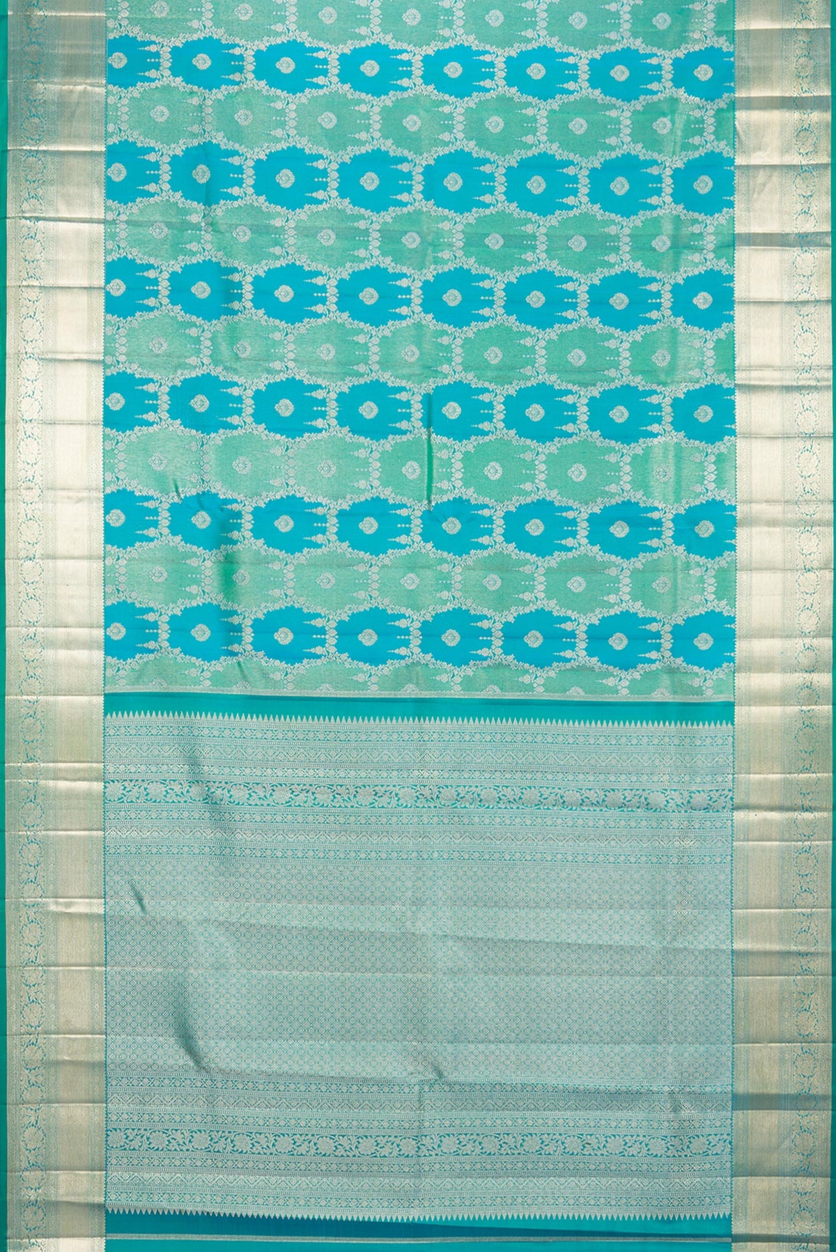 Flat view of Pure Silk Sea Green and Peacock Blue Color Kanjivaram Saree with Zari Brocade on the body and Zari Border. 