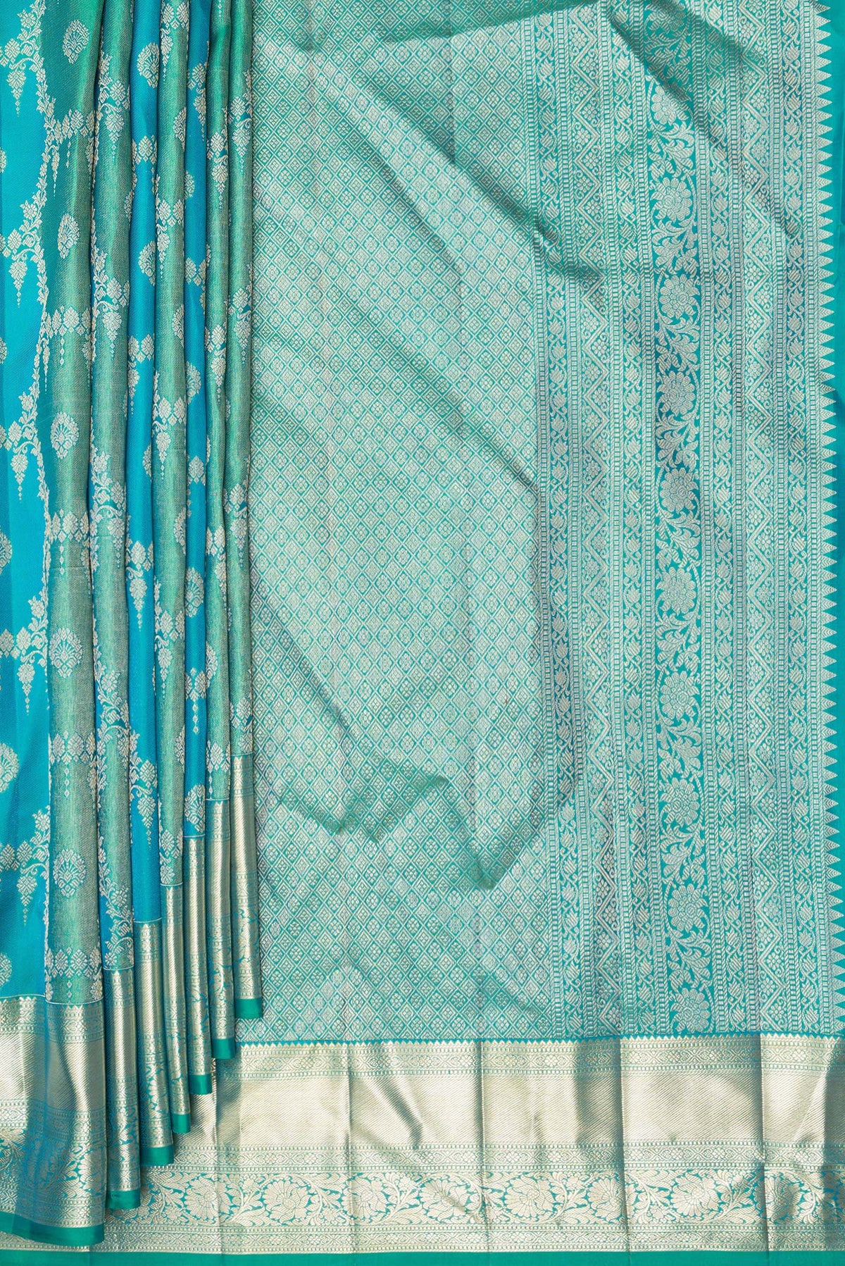 Pleats and pallu of Pure Silk Sea Green and Peacock Blue Color Kanjivaram Saree with Zari Brocade on the body and Zari Border. 