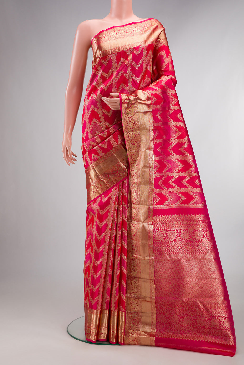 Pure Silk Dark Pink Kanjivaram Saree with Zari Brocade on the body and Zari Border.  displayed on a mannequin