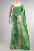 Pure Silk Green Dual Tone Kanjivaram Saree with Zari Brocade on the body and Zari Border.  displayed on a mannequin