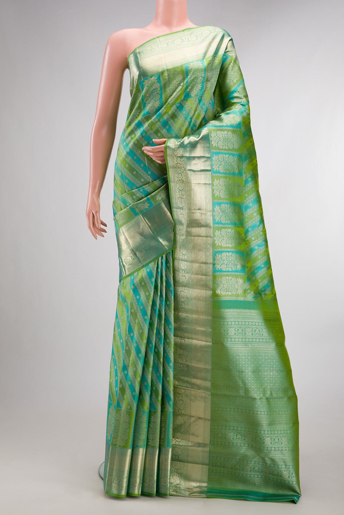 Pure Silk Green Dual Tone Kanjivaram Saree with Zari Brocade on the body and Zari Border.  displayed on a mannequin