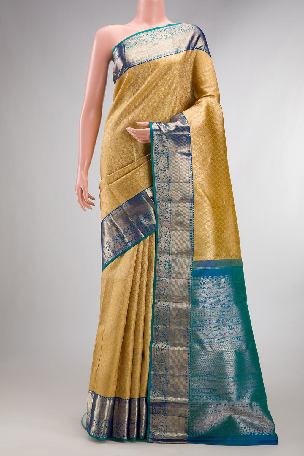 Pure Silk Sandal Dual Tone Kanjivaram Saree with Zari Brocade on the body and Zari Border.  displayed on a mannequin