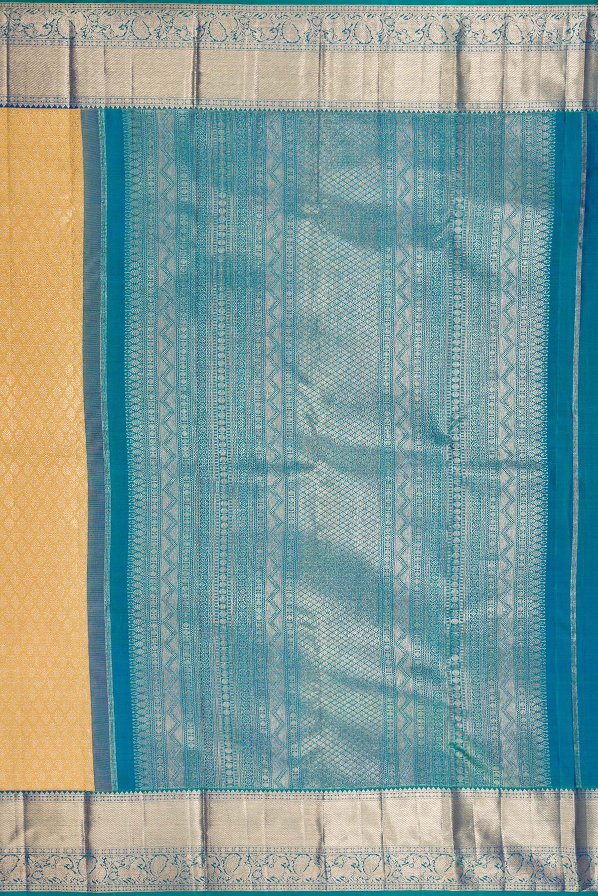 Close up image of the pallu of Pure Silk Sandal Dual Tone Kanjivaram Saree with Zari Brocade on the body and Zari Border. 