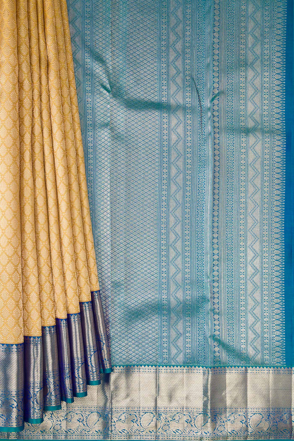 Pleats and pallu of Pure Silk Sandal Dual Tone Kanjivaram Saree with Zari Brocade on the body and Zari Border. 