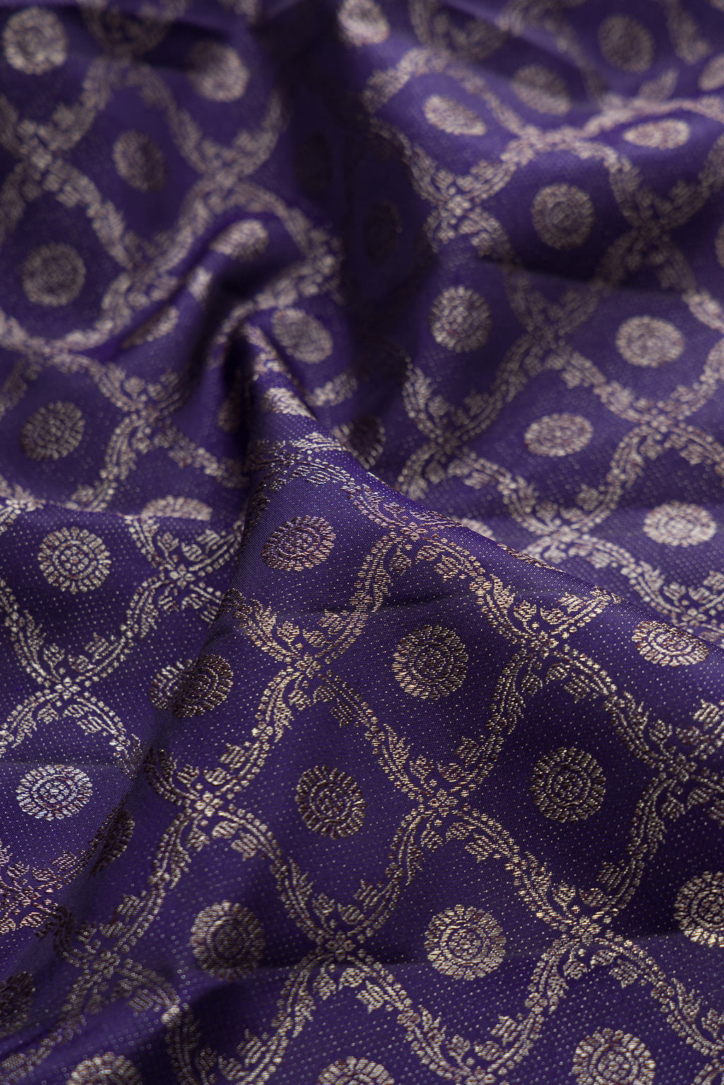 Close up of Pure Silk Navy Blue Kanjivaram Saree with Zari Brocade on the body and Fancy Border.  displaying folds