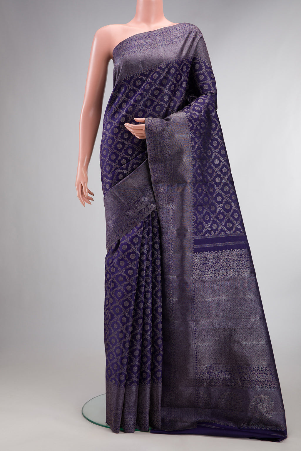 Pure Silk Navy Blue Kanjivaram Saree with Zari Brocade on the body and Fancy Border.  displayed on a mannequin