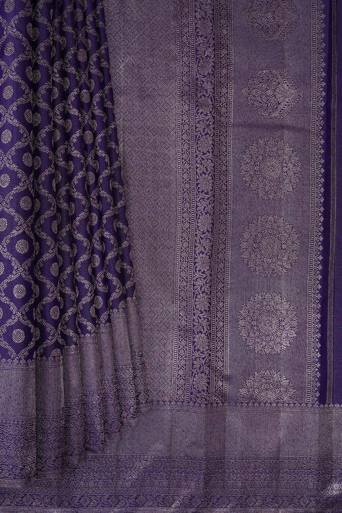 Pleats and pallu of Pure Silk Navy Blue Kanjivaram Saree with Zari Brocade on the body and Fancy Border. 