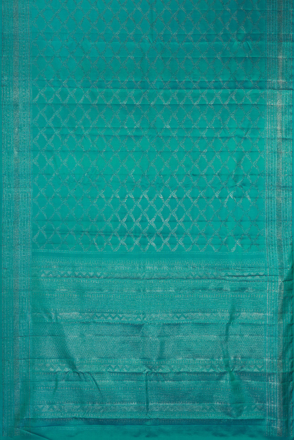 Flat view of Pure Silk Turquoise Kanjivaram Saree with Zari Brocade on the body and Fancy Border. 