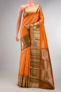 Pure Silk Orange Kanchipuram Saree with Zari Brocade on the body and Fancy Border.  displayed on a mannequin