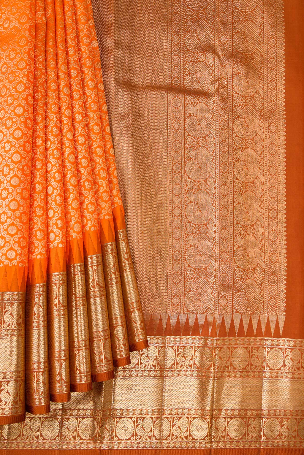 Pleats and pallu of Pure Silk Orange Kanchipuram Saree with Zari Brocade on the body and Fancy Border. 