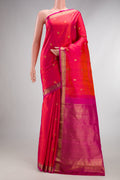 Pure Silk Coral Dual Tone Kanjivaram Saree with Zari Butta on the body and Zari Border.  displayed on a mannequin