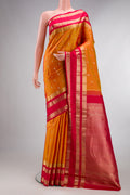 Pure Silk Mustard Kanjivaram Saree with Zari Butta on the body and Zari Border.  displayed on a mannequin