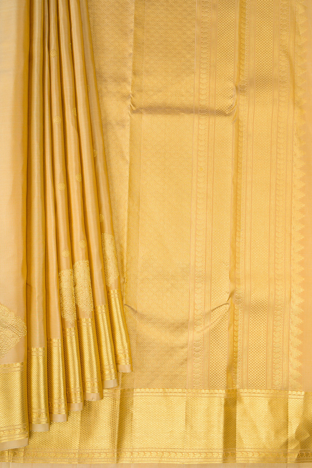 Pleats and pallu of Pure Silk Sandal Kanchipuram Saree with Zari Butta on the body and Zari Border. 
