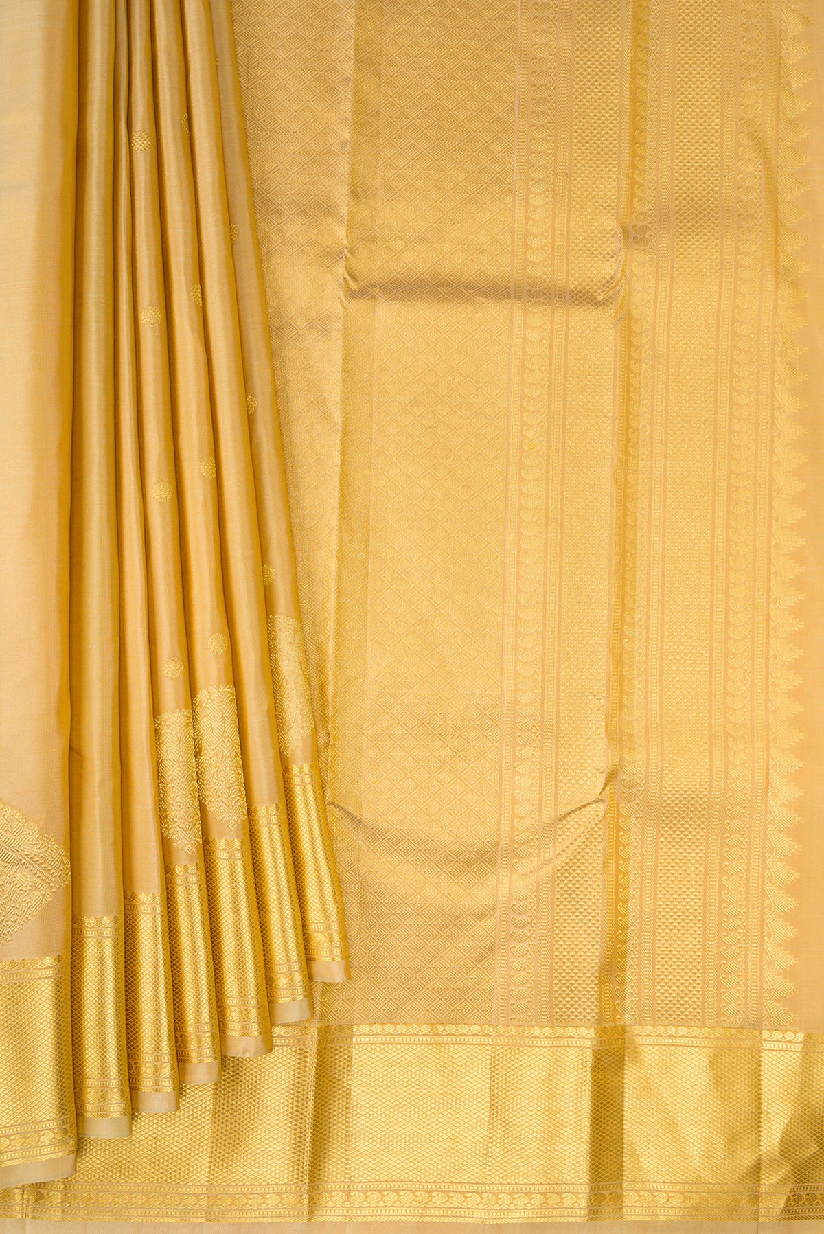 Pleats and pallu of Pure Silk Sandal Kanchipuram Saree with Zari Butta on the body and Zari Border. 