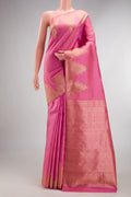 Pure Silk Pink Kanchipuram Saree with Plain Body and Temple Border.  displayed on a mannequin