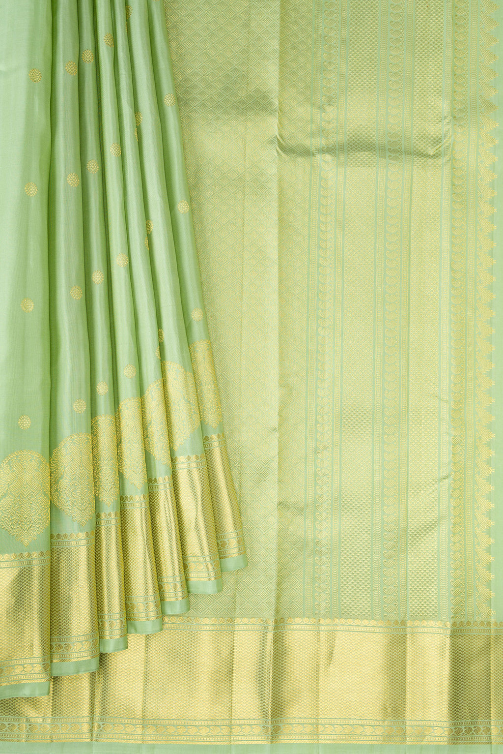 Pleats and pallu of Pure Silk Pista Green Kanchipuram Saree with Zari Butta on the body and Zari Border. 
