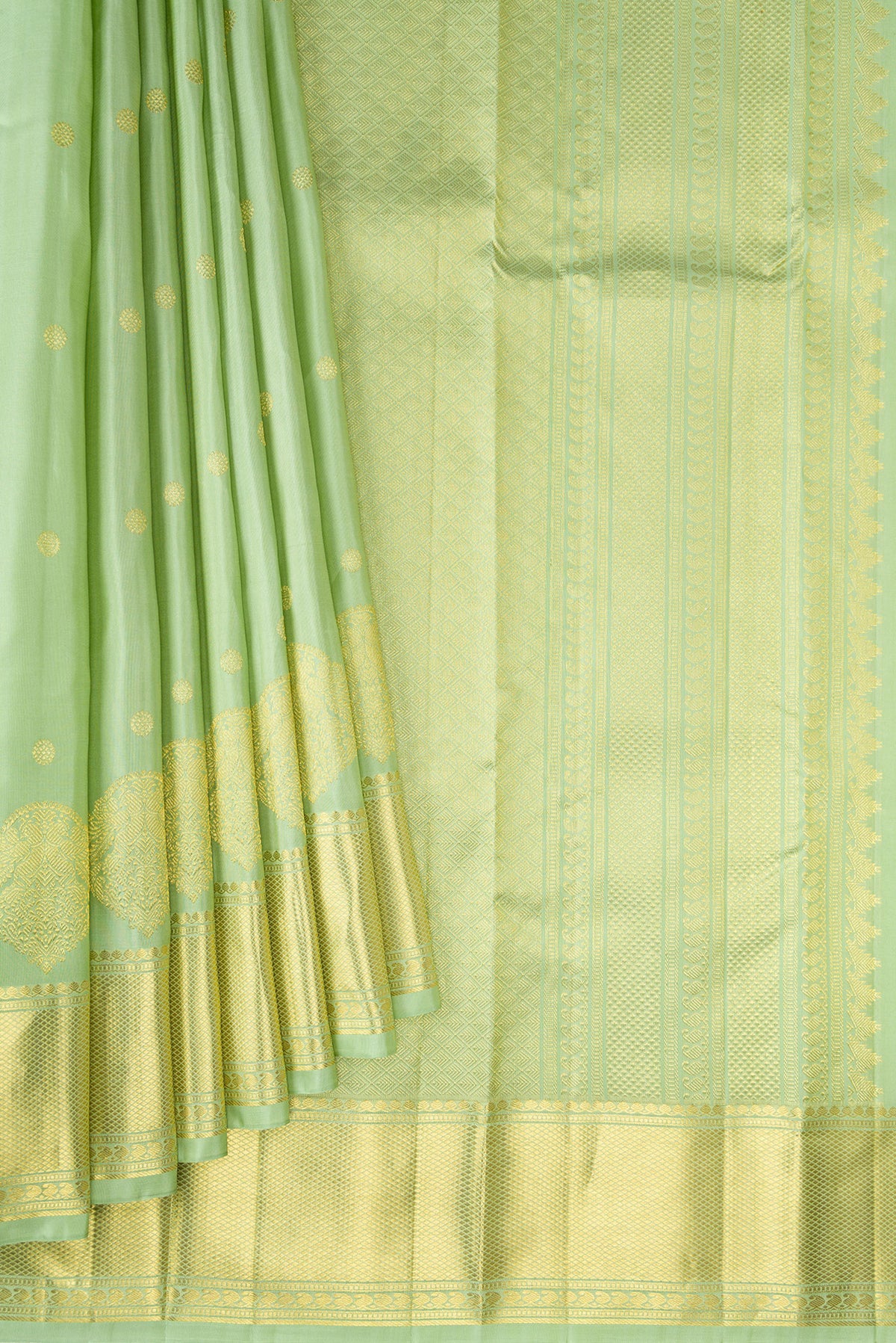 Pleats and pallu of Pure Silk Pista Green Kanchipuram Saree with Zari Butta on the body and Zari Border. 