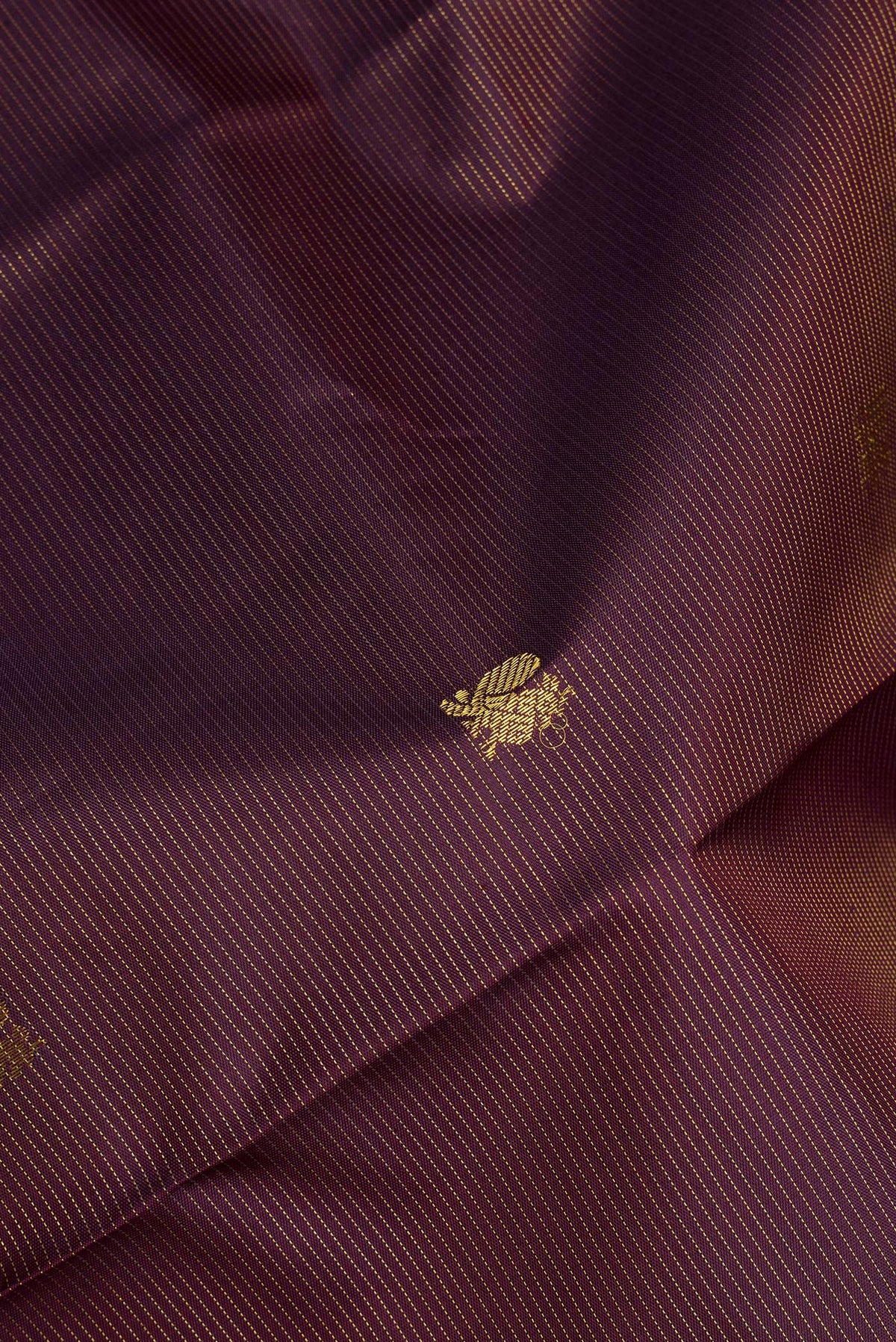 Close up of Pure Silk Coffee Brown Dual Tone Kanjivaram Saree with Stripes on the body and Zari Border.  displaying folds