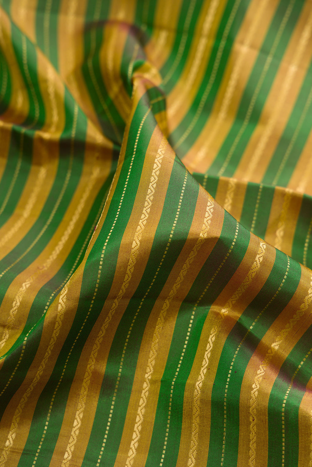 Close up of Pure Silk Multi Color Kanchipuram Saree with Stripes on the body and Zari Border.  displaying folds