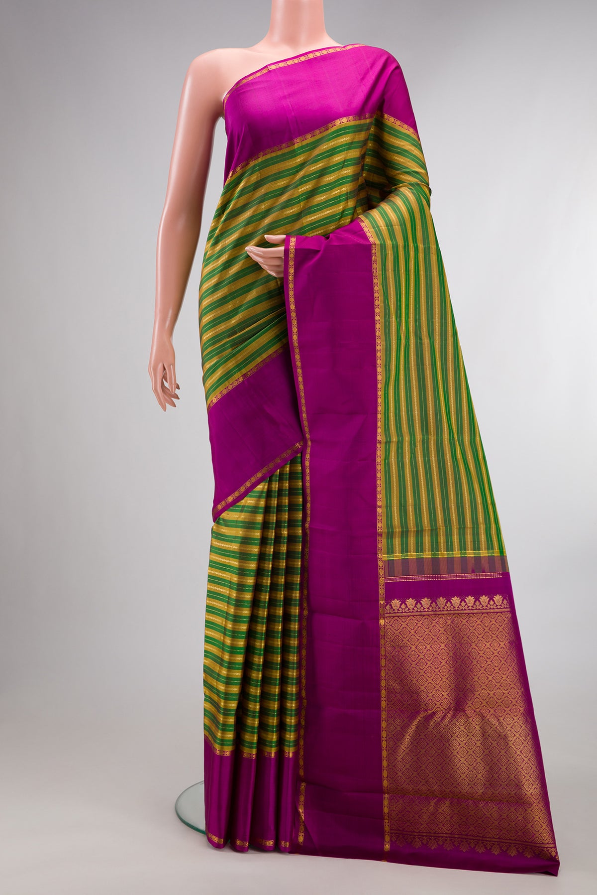 Pure Silk Multi Color Kanchipuram Saree with Stripes on the body and Zari Border.  displayed on a mannequin