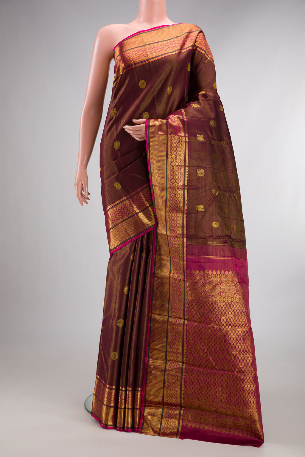 Pure Silk Maroon Dual Tone Kanjivaram Saree with Stripes on the body and Zari Border.  displayed on a mannequin