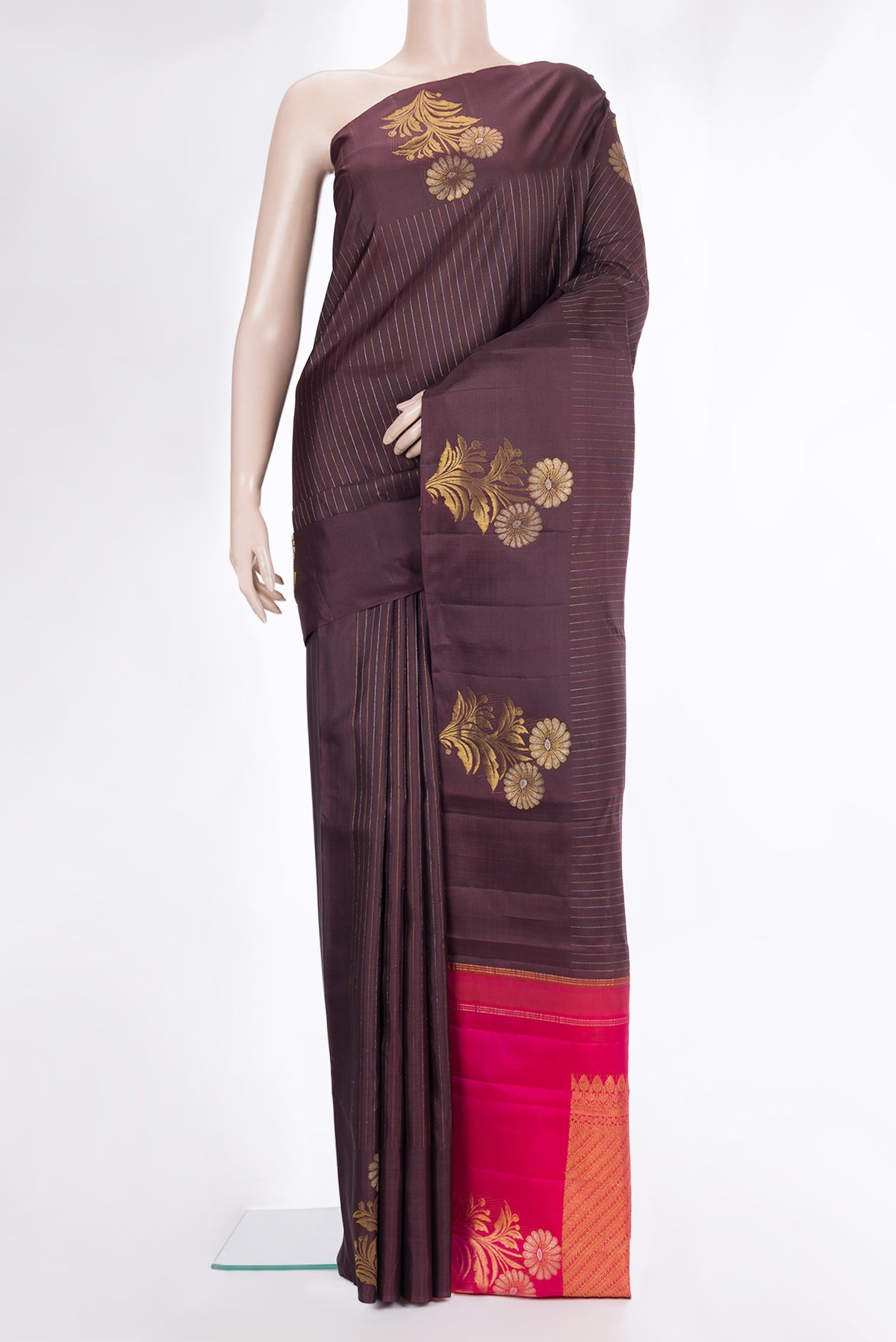 Pure Silk Brown Kanjivaram Saree with Stripes on the body and Fancy Border.  displayed on a mannequin