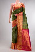 Pure Silk Bottle Green Kanchipuram Saree with Checked design on the body and Zari Border.  displayed on a mannequin