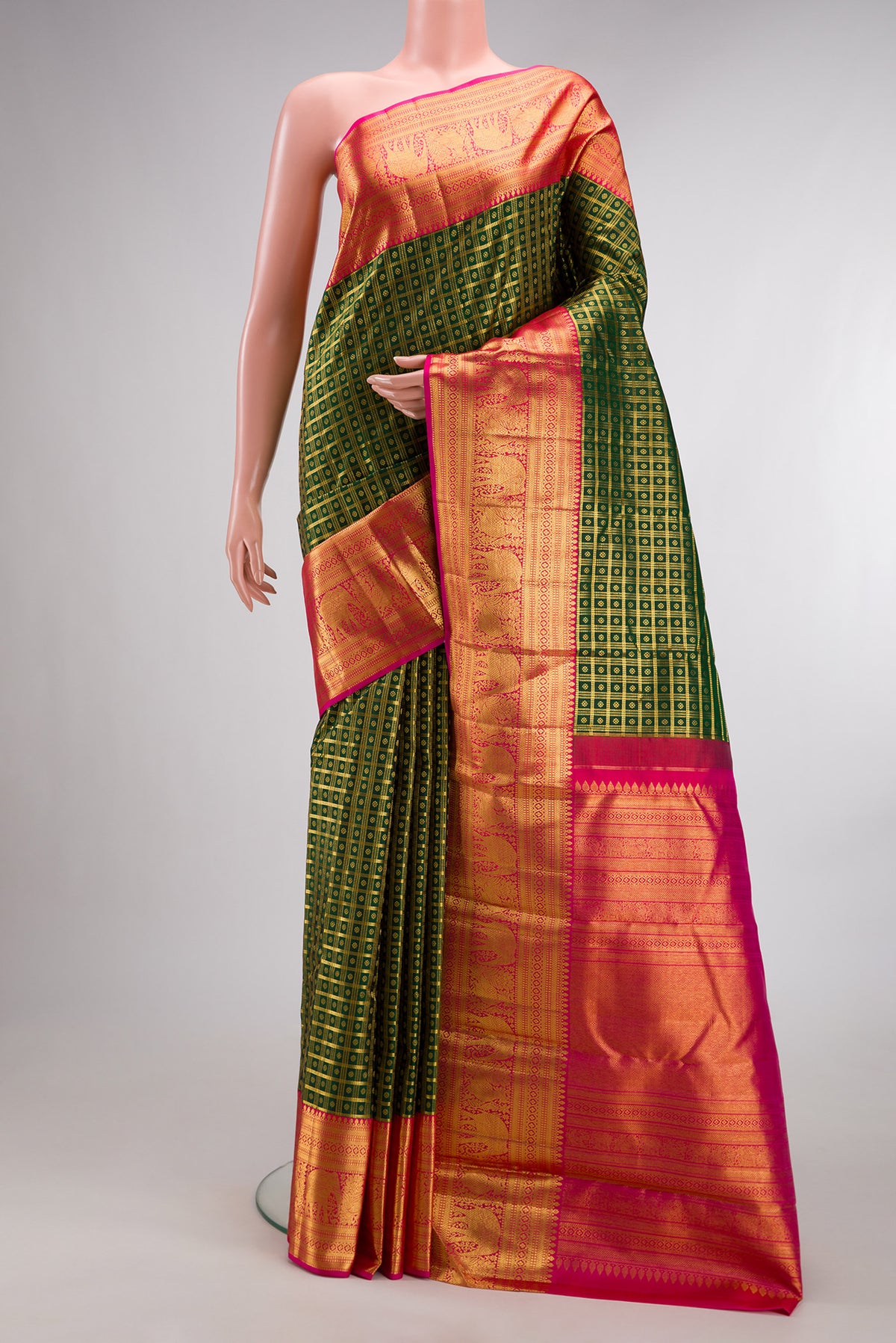 Pure Silk Bottle Green Kanchipuram Saree with Checked design on the body and Zari Border.  displayed on a mannequin