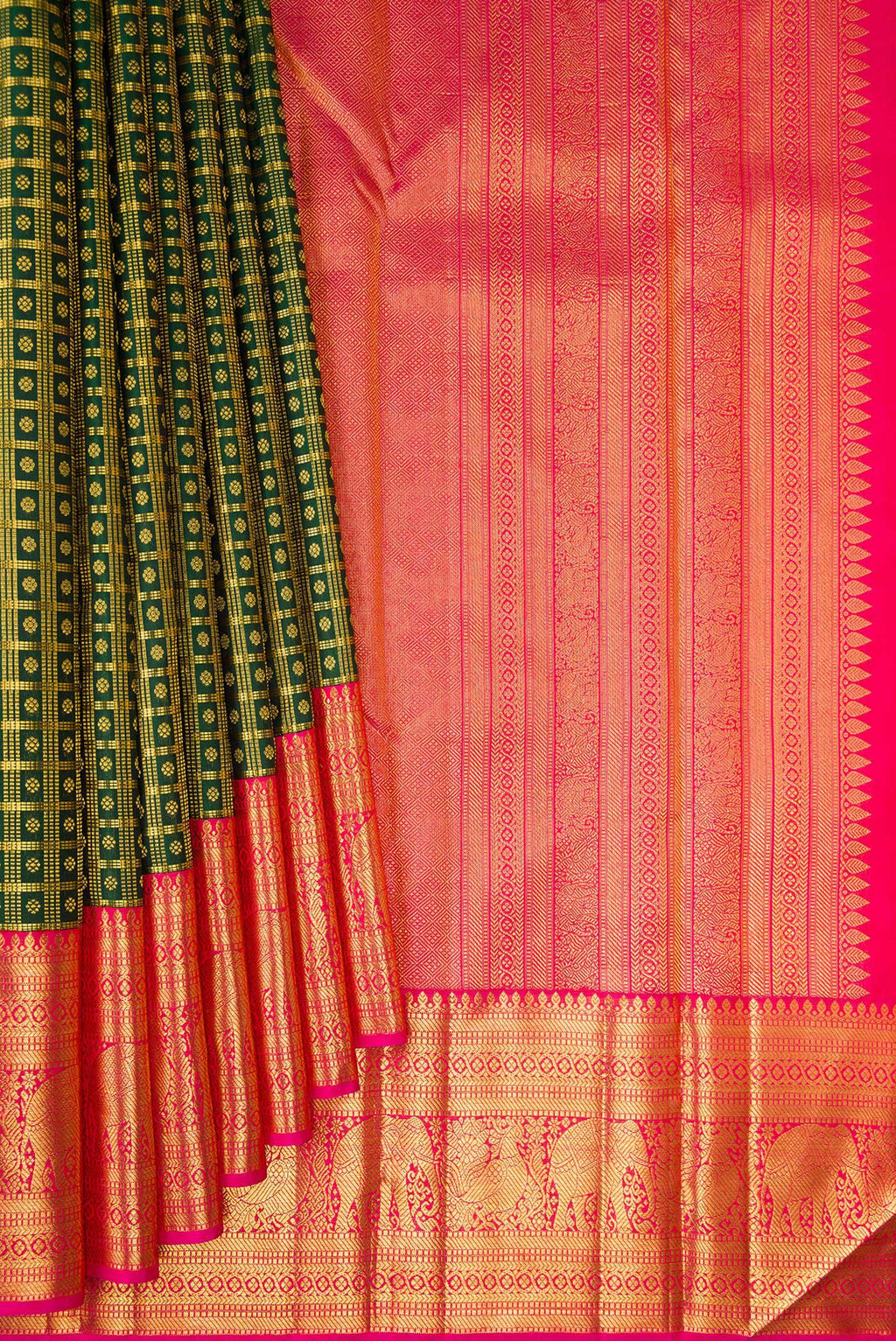 Pleats and pallu of Pure Silk Bottle Green Kanchipuram Saree with Checked design on the body and Zari Border. 