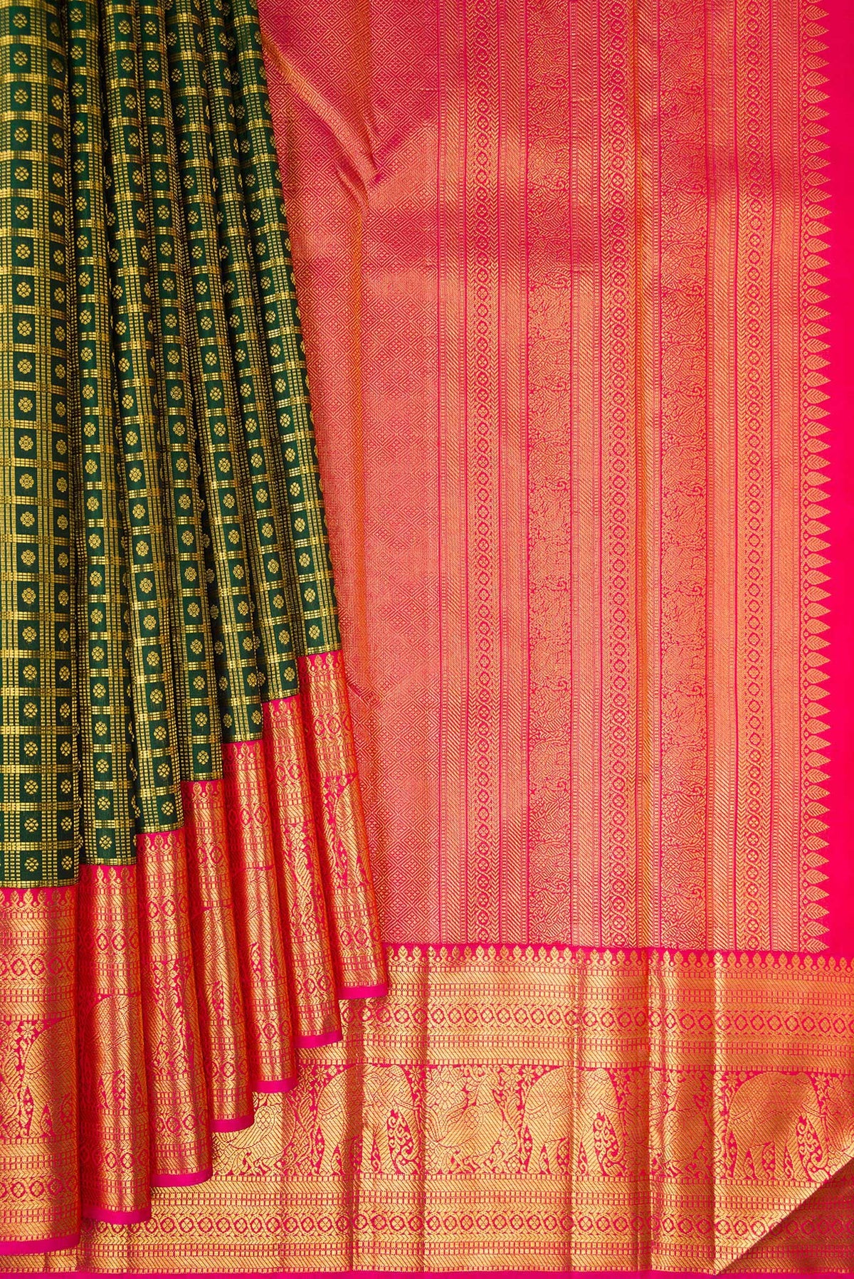 Pleats and pallu of Pure Silk Bottle Green Kanchipuram Saree with Checked design on the body and Zari Border. 
