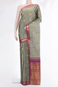 Pure Silk Grey Dual Tone Kanchipuram Saree with Zari Butta on the body and Zari Border.  displayed on a mannequin