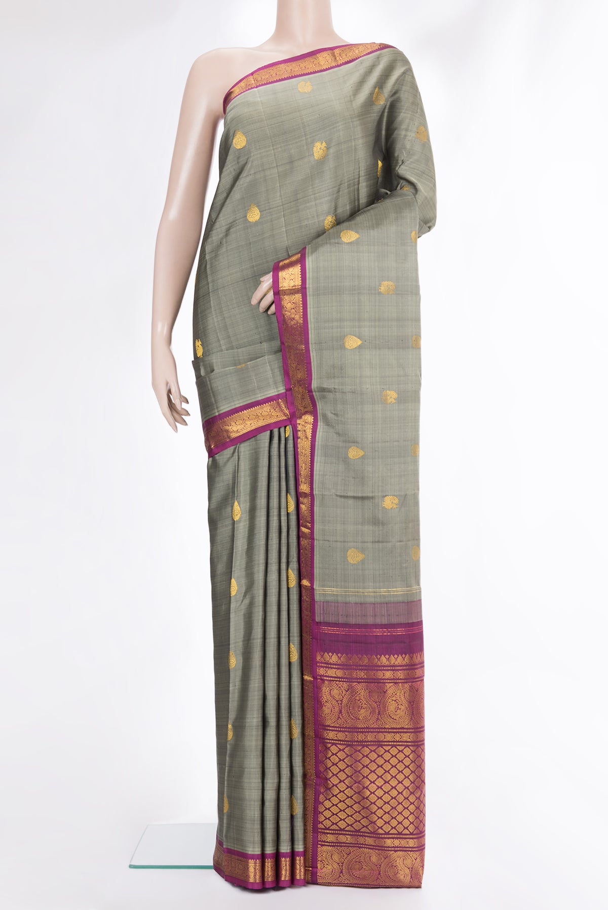 Pure Silk Grey Dual Tone Kanchipuram Saree with Zari Butta on the body and Zari Border.  displayed on a mannequin