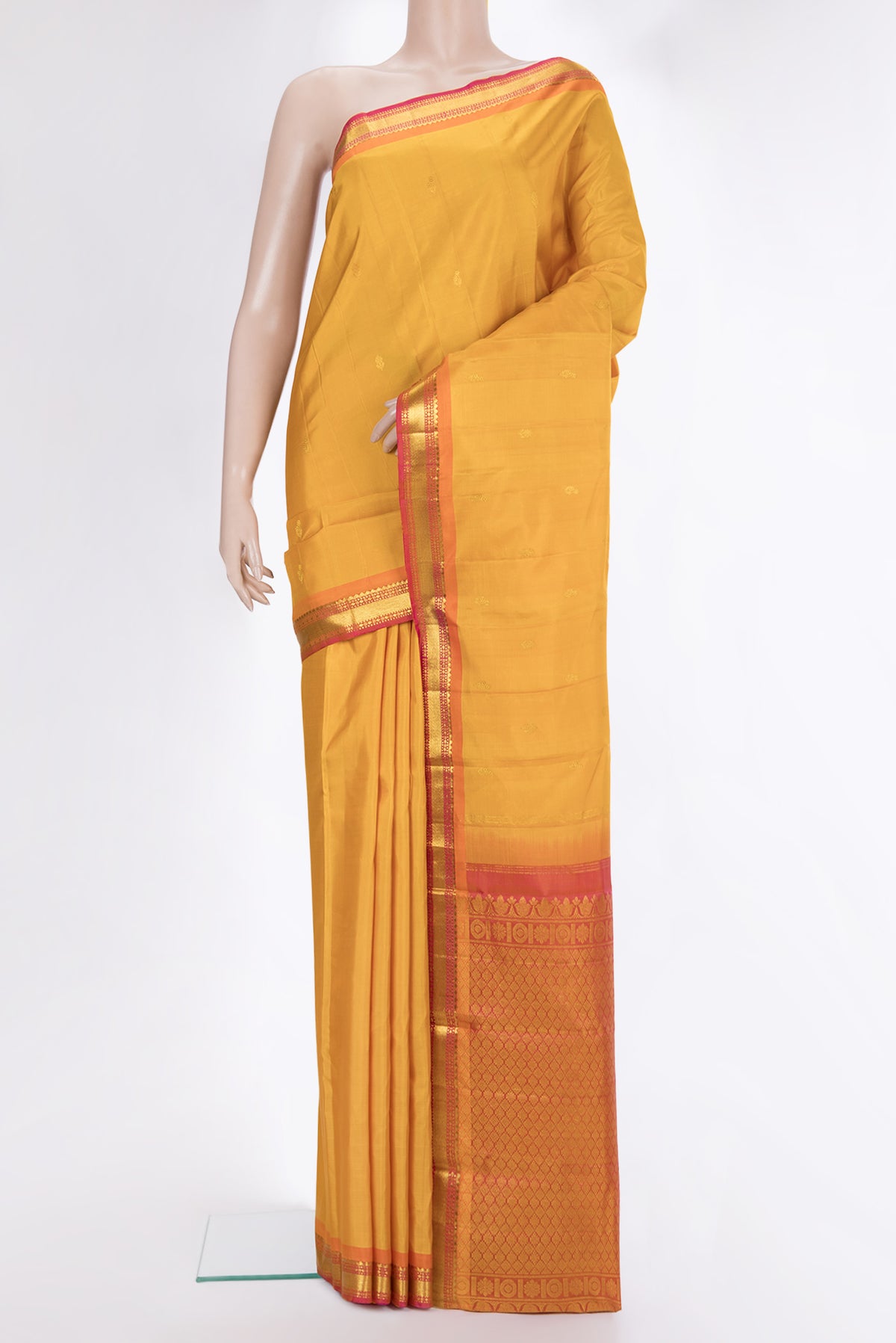 Pure Silk Mustard Dual Tone Kanchipuram Saree with Zari Butta on the body and Zari Border.  displayed on a mannequin