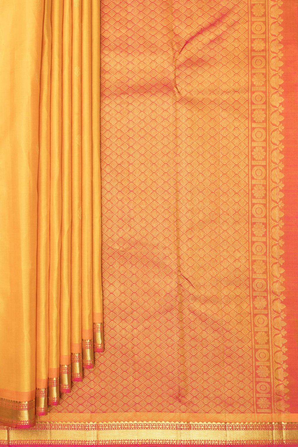 Pleats and pallu of Pure Silk Mustard Dual Tone Kanchipuram Saree with Zari Butta on the body and Zari Border. 