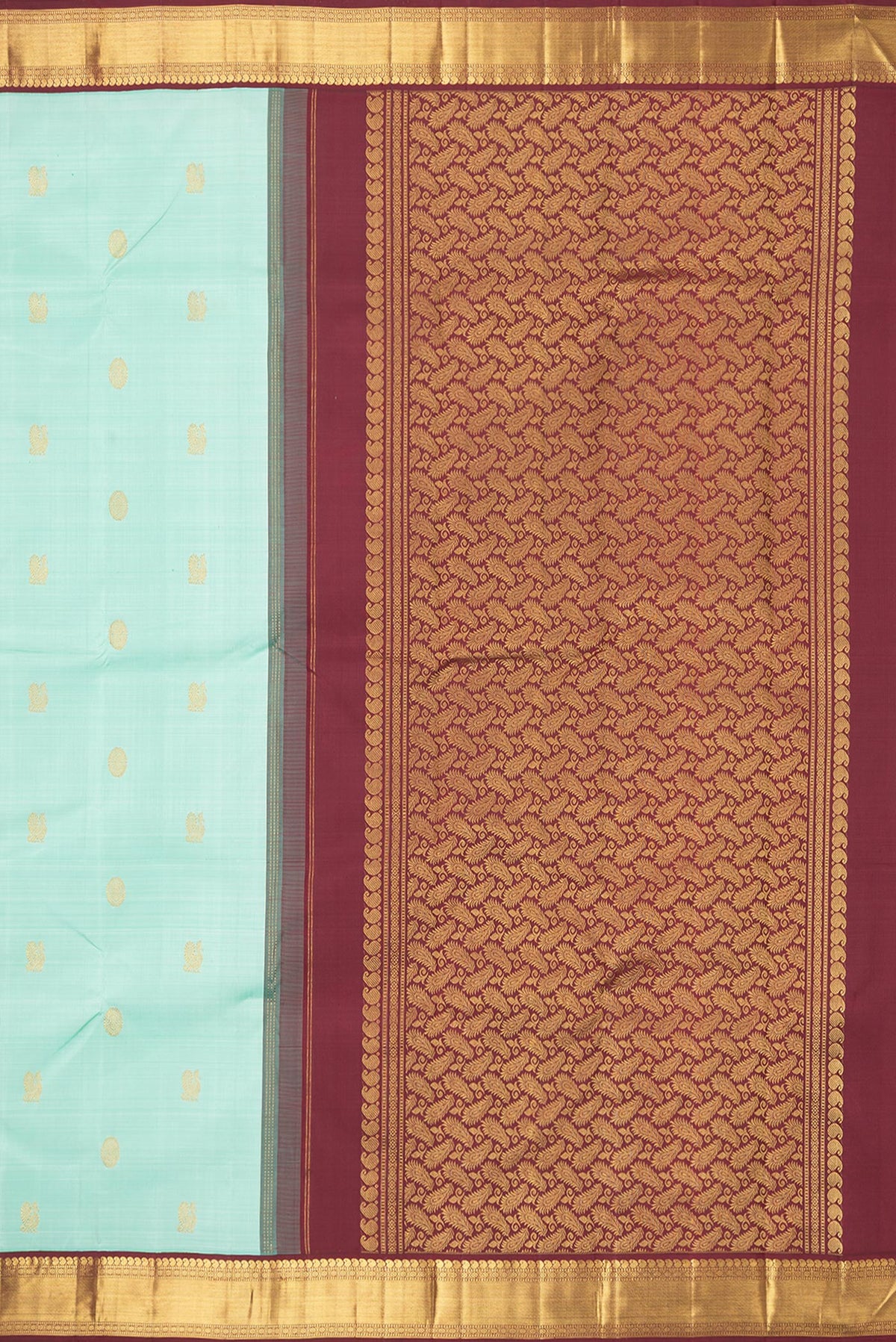 Close up image of the pallu of Pure Silk Pista Green Dual Tone Kanjivaram Saree with Zari Butta on the body and Zari Border. 