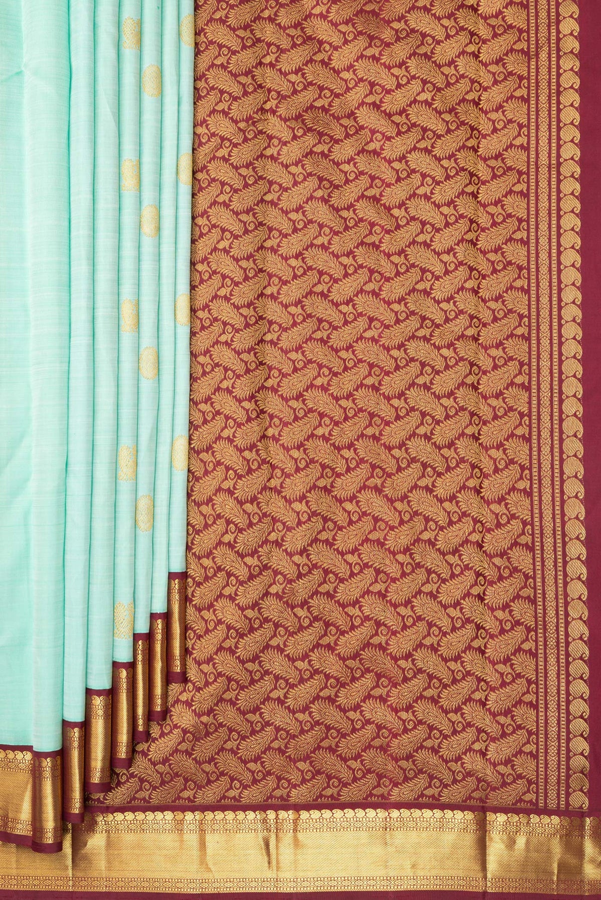 Pleats and pallu of Pure Silk Pista Green Dual Tone Kanjivaram Saree with Zari Butta on the body and Zari Border. 