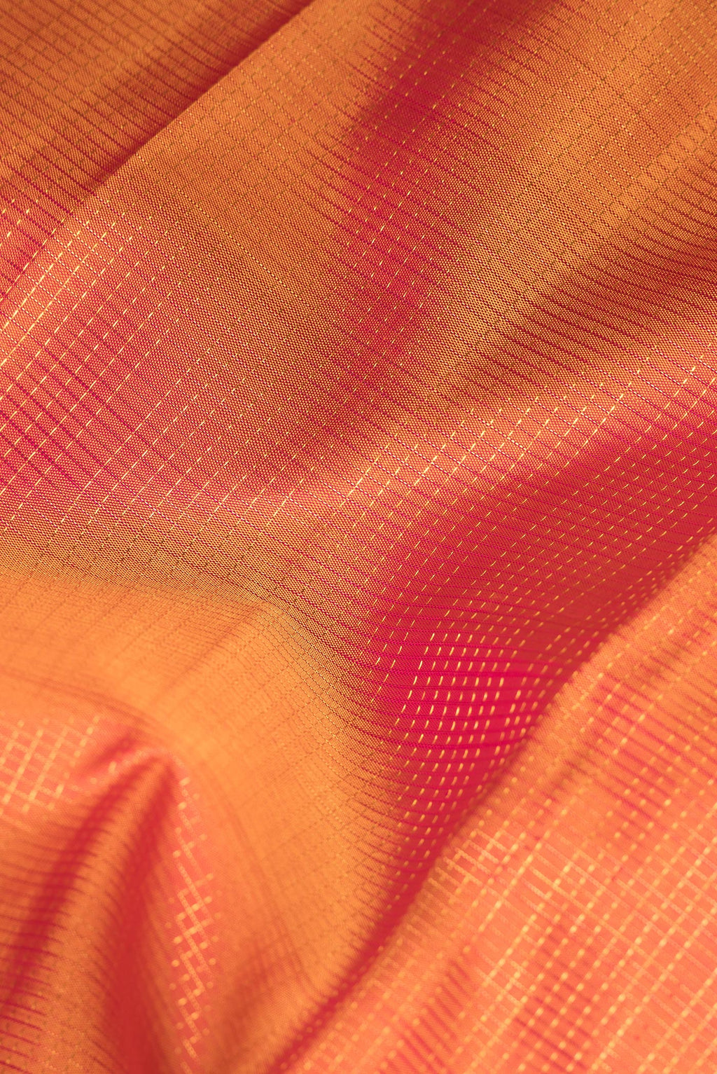 Close up of Pure Silk Mustard Kanjivaram Saree with Checked design on the body and Zari Border.  displaying folds