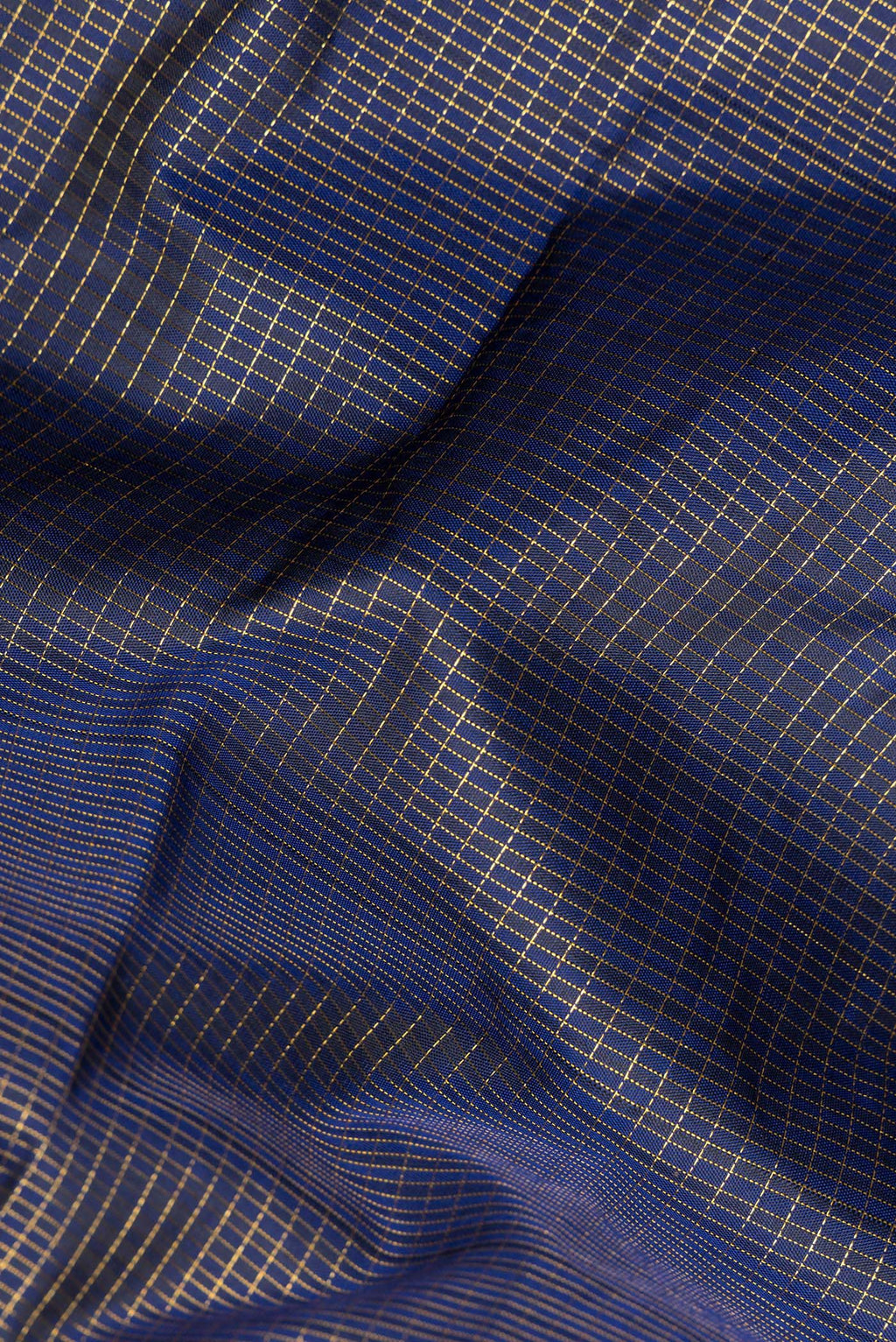Close up of Pure Silk Navy Blue Dual Tone Kanjivaram Saree with Checked design on the body and Zari Border.  displaying folds