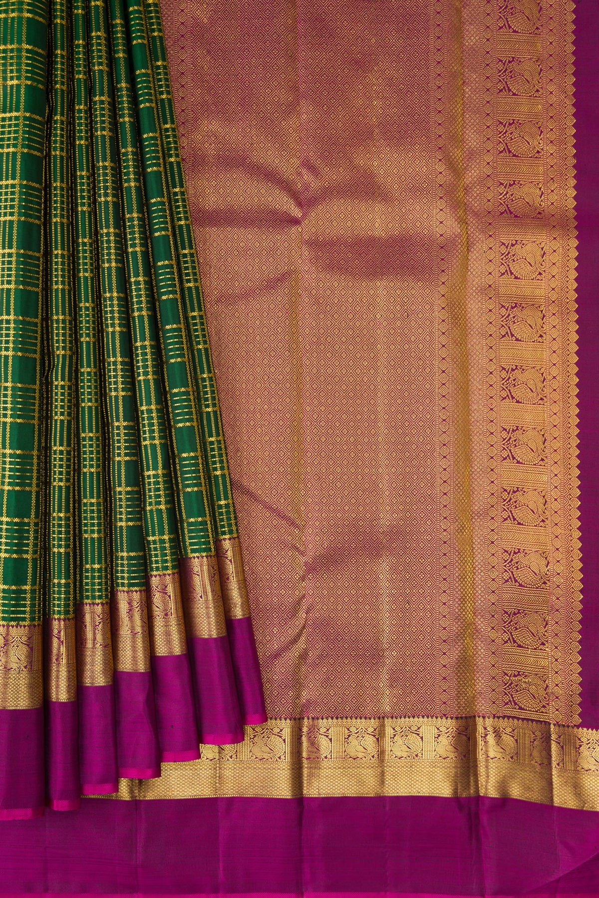 Pleats and pallu of Pure Silk Bottle Green Kanchipuram Saree with Checked design on the body and Zari Border. 