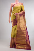 Pure Silk Gold Dual Tone Kanchipuram Saree with Zari Brocade on the body and Zari Border.  displayed on a mannequin