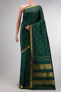 Pure Silk Pure Zari Bottle Green Kanchipuram Saree with Zari Butta on the body and Zari Border.  displayed on a mannequin