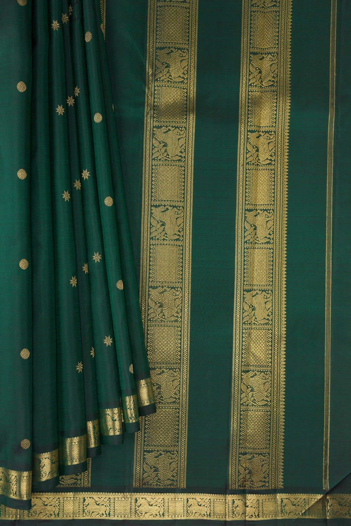Pleats and pallu of Pure Silk Pure Zari Bottle Green Kanchipuram Saree with Zari Butta on the body and Zari Border. 