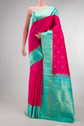 Pure Silk Pure Zari Rani Pink Kanjivaram Saree with Zari Butta on the body and Zari Border.  displayed on a mannequin