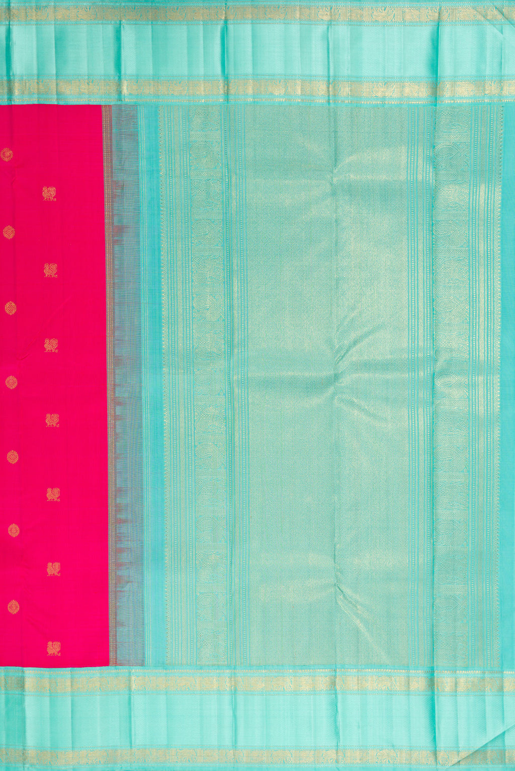 Close up image of the pallu of Pure Silk Pure Zari Rani Pink Kanjivaram Saree with Zari Butta on the body and Zari Border. 