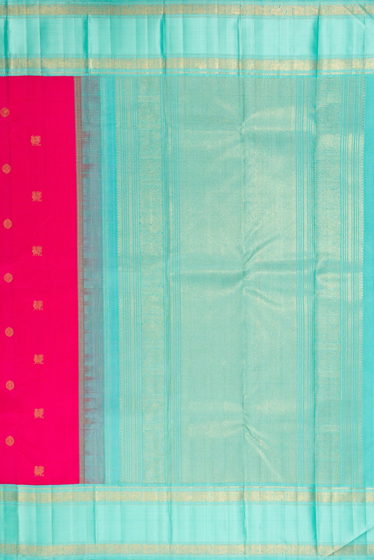 Close up image of the pallu of Pure Silk Pure Zari Rani Pink Kanjivaram Saree with Zari Butta on the body and Zari Border. 