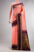 Pure Silk Pure Zari Peach Kanjivaram Saree with Zari Butta on the body and Zari Border.  displayed on a mannequin