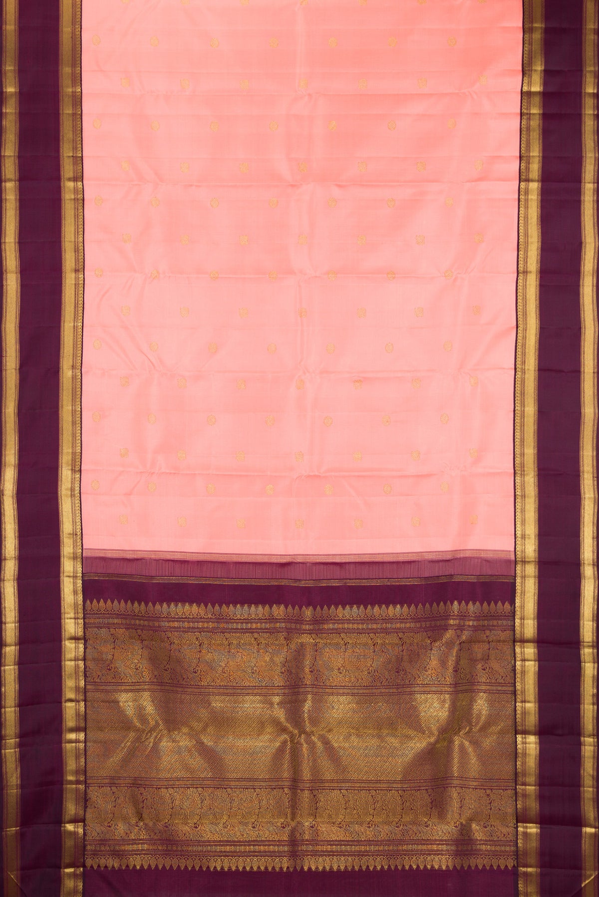Flat view of Pure Silk Pure Zari Peach Kanjivaram Saree with Zari Butta on the body and Zari Border. 