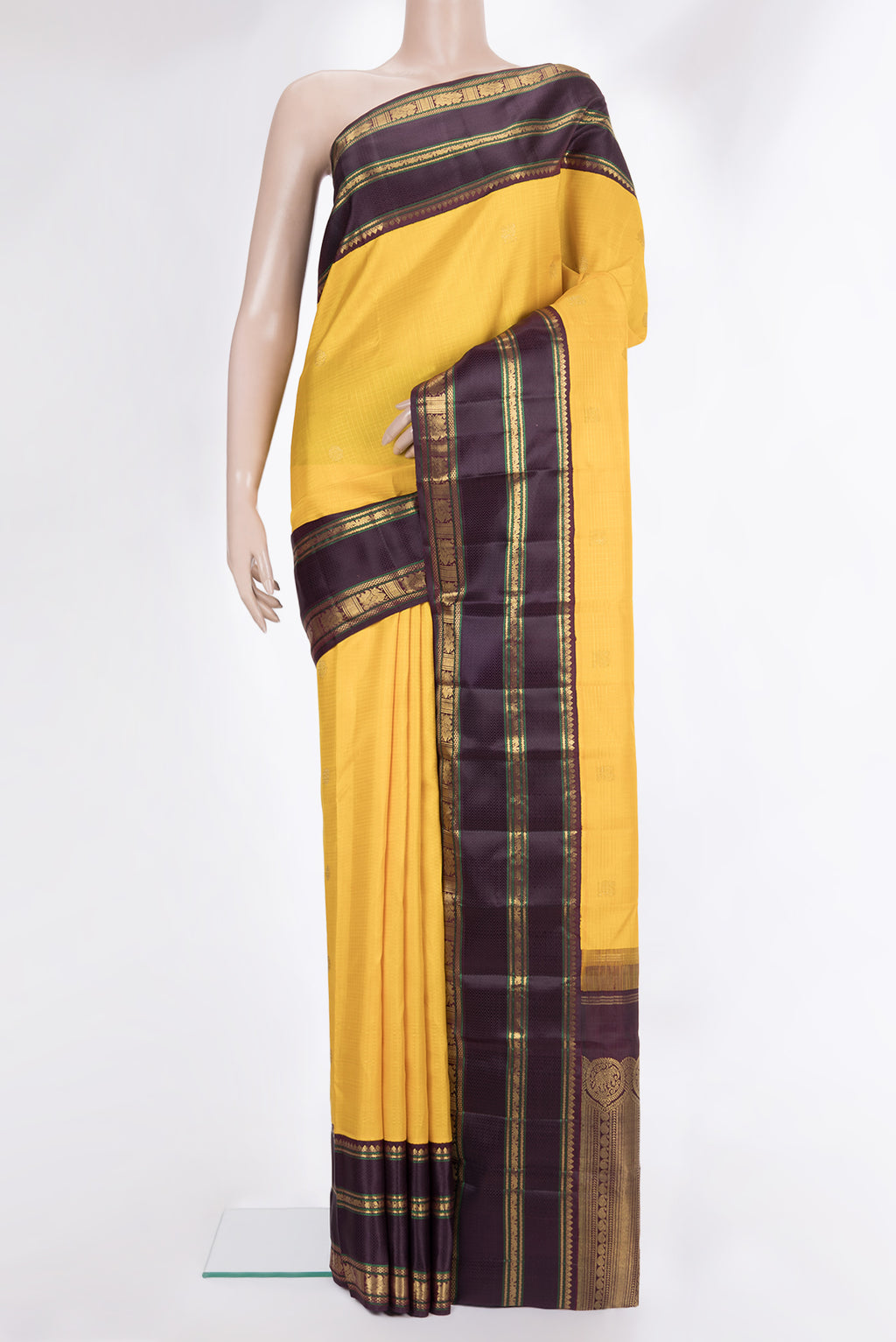 Pure Silk Yellow Dual Tone Kanchipuram Saree with Checked design on the body and Zari Border.  displayed on a mannequin