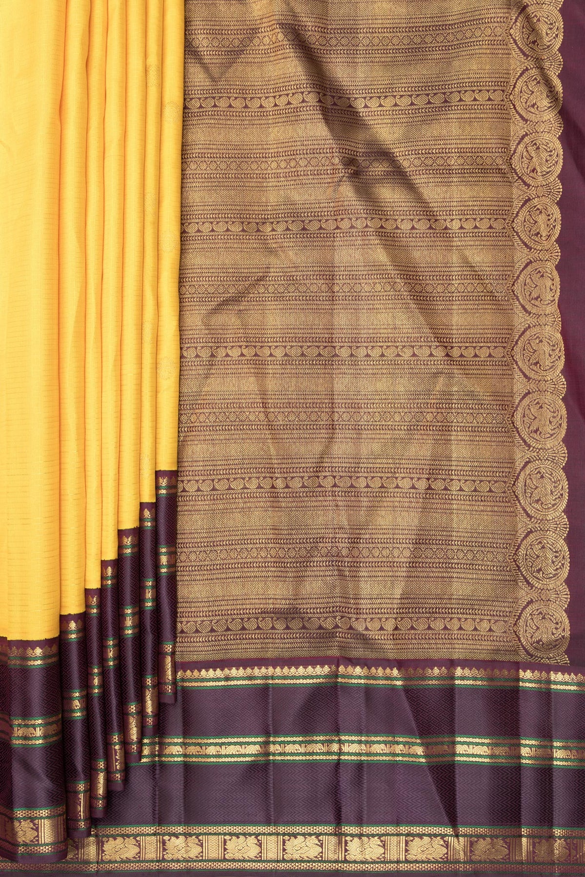 Pleats and pallu of Pure Silk Yellow Dual Tone Kanchipuram Saree with Checked design on the body and Zari Border. 