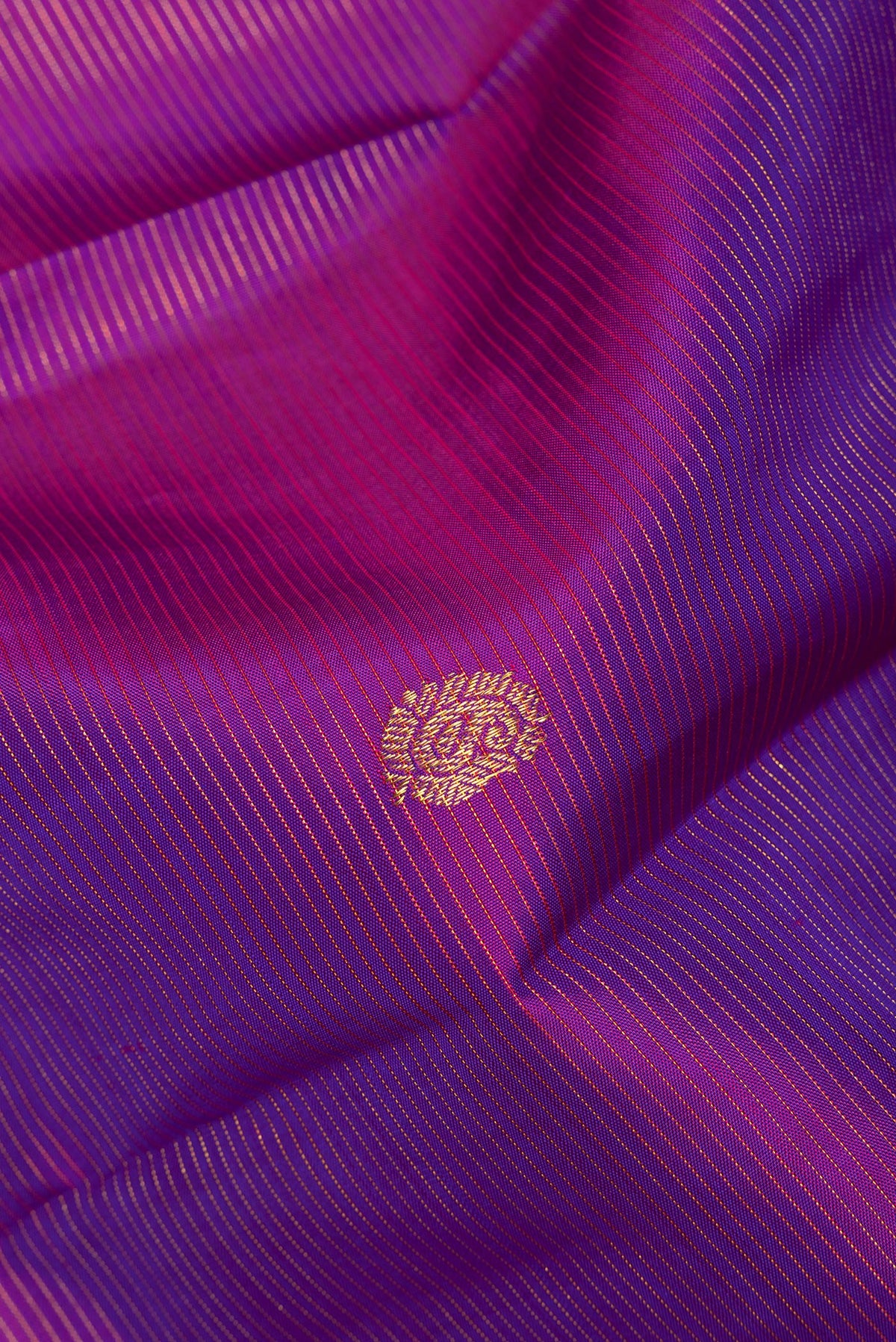 Close up of Pure Silk Purple Dual Tone Kanjivaram Saree with Stripes on the body and Zari Border.  displaying folds